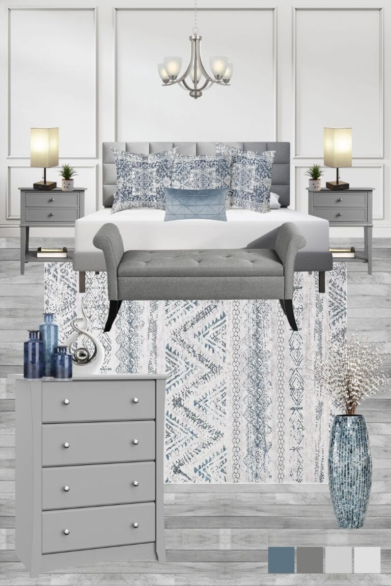 Elegant grey and blue master bedroom design with a grey headboard, grey nightstands and dresser, and a grey bedroom bench. Pops of blue are added throughout with the accent pillows, a blue floor vase, blue table vases, and an area rug with a blue pattern.