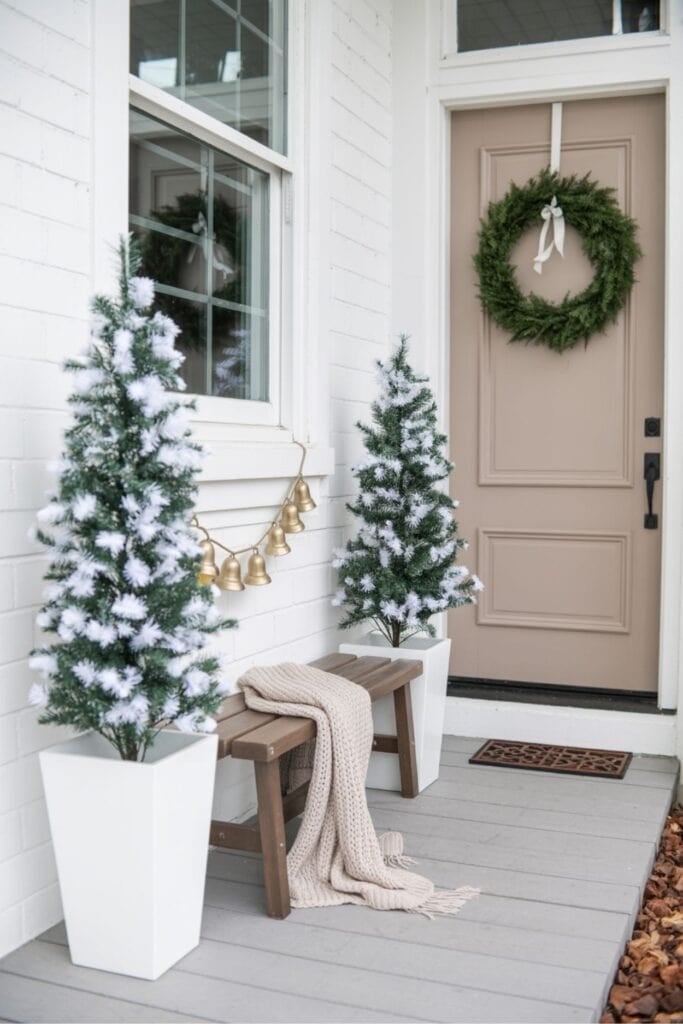 Snow-Kissed Christmas Porch with Mini Trees and Neutral Door