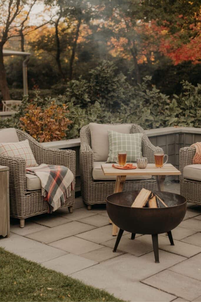 Cozy Patio Fire Pit with Plaid Throws and Cider