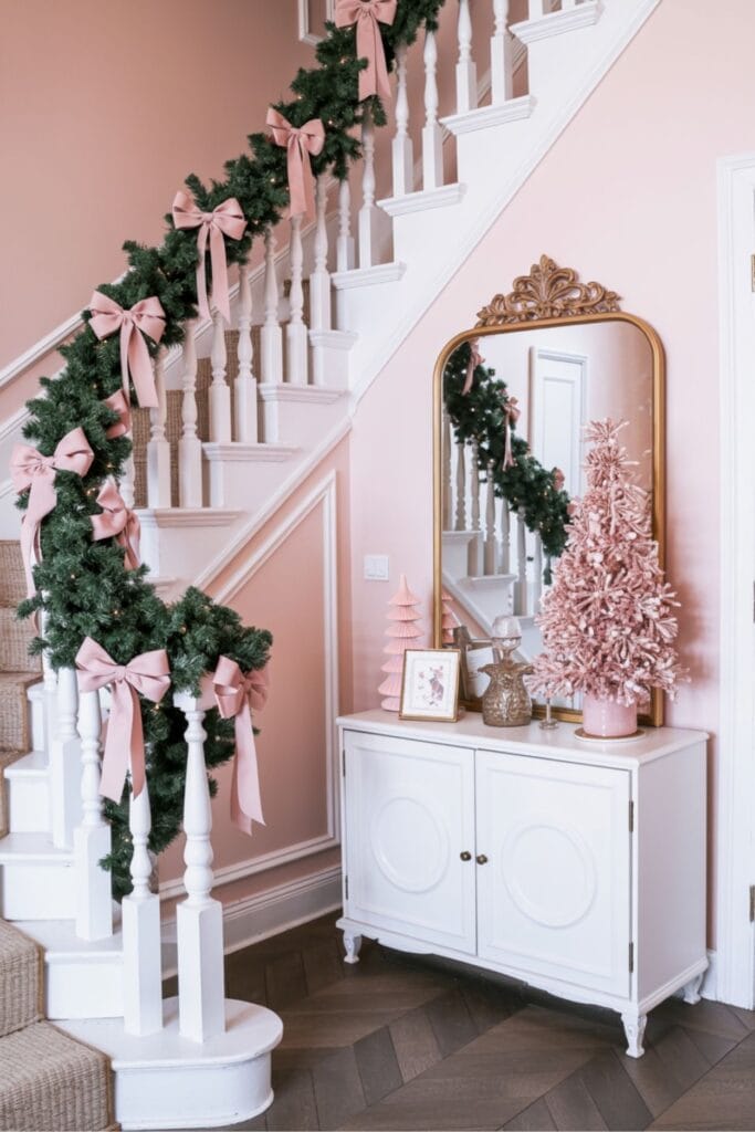 Pink Christmas Entryway with Garland and Bows